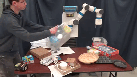 b) Fetch robot at PROGRESS lab sorting object from clutter (Professor Chad Jenkins et al.).